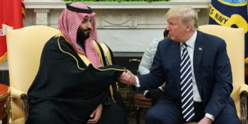 US President Donald Trump (R) shakes hands with Saudi Arabia's Crown Prince Mohammed bin Salman in the Oval Office of the White House on March 20, 2018 in Washington, DC. (Photo by MANDEL NGAN / AFP)