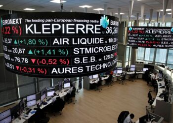 FILE PHOTO: Company stock price information, including Klepierre SA, is displayed on screens as they hang above the Paris stock exchange, operated by Euronext NV, in La Defense business district in Paris, France, December 14, 2016. REUTERS/Benoit Tessier