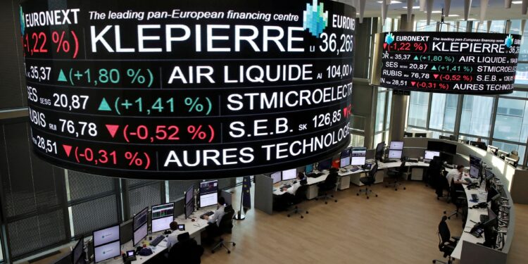 FILE PHOTO: Company stock price information, including Klepierre SA, is displayed on screens as they hang above the Paris stock exchange, operated by Euronext NV, in La Defense business district in Paris, France, December 14, 2016. REUTERS/Benoit Tessier