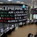 FILE PHOTO: Company stock price information, including Klepierre SA, is displayed on screens as they hang above the Paris stock exchange, operated by Euronext NV, in La Defense business district in Paris, France, December 14, 2016. REUTERS/Benoit Tessier